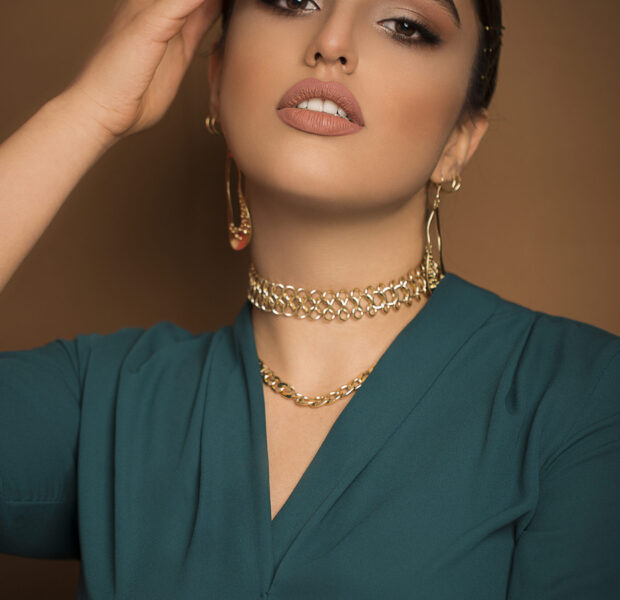 Flamenco dancer model in blue outfit and dance updo romantic posing Flamenco dancer model in blue outfit and dance updo romantic posing